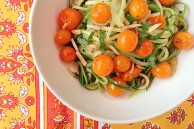 Zucchini noodles with cherry tomatoes, almonds and basil