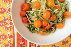 Zucchini noodles with cherry tomatoes, almonds and basil